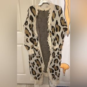 very heavy cardigan. Can fit any size depending on the fit you want. I’m a m/l